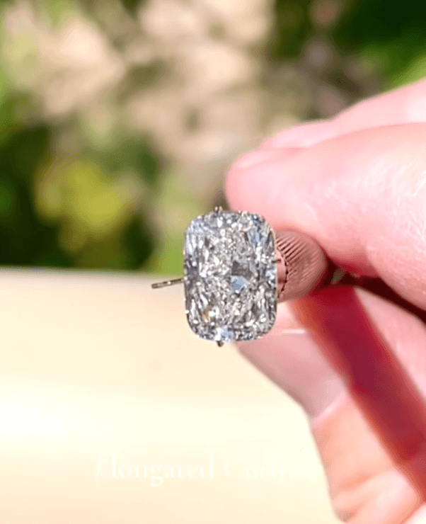 Elongated cushion cut diamond ready to be set in a custom band.